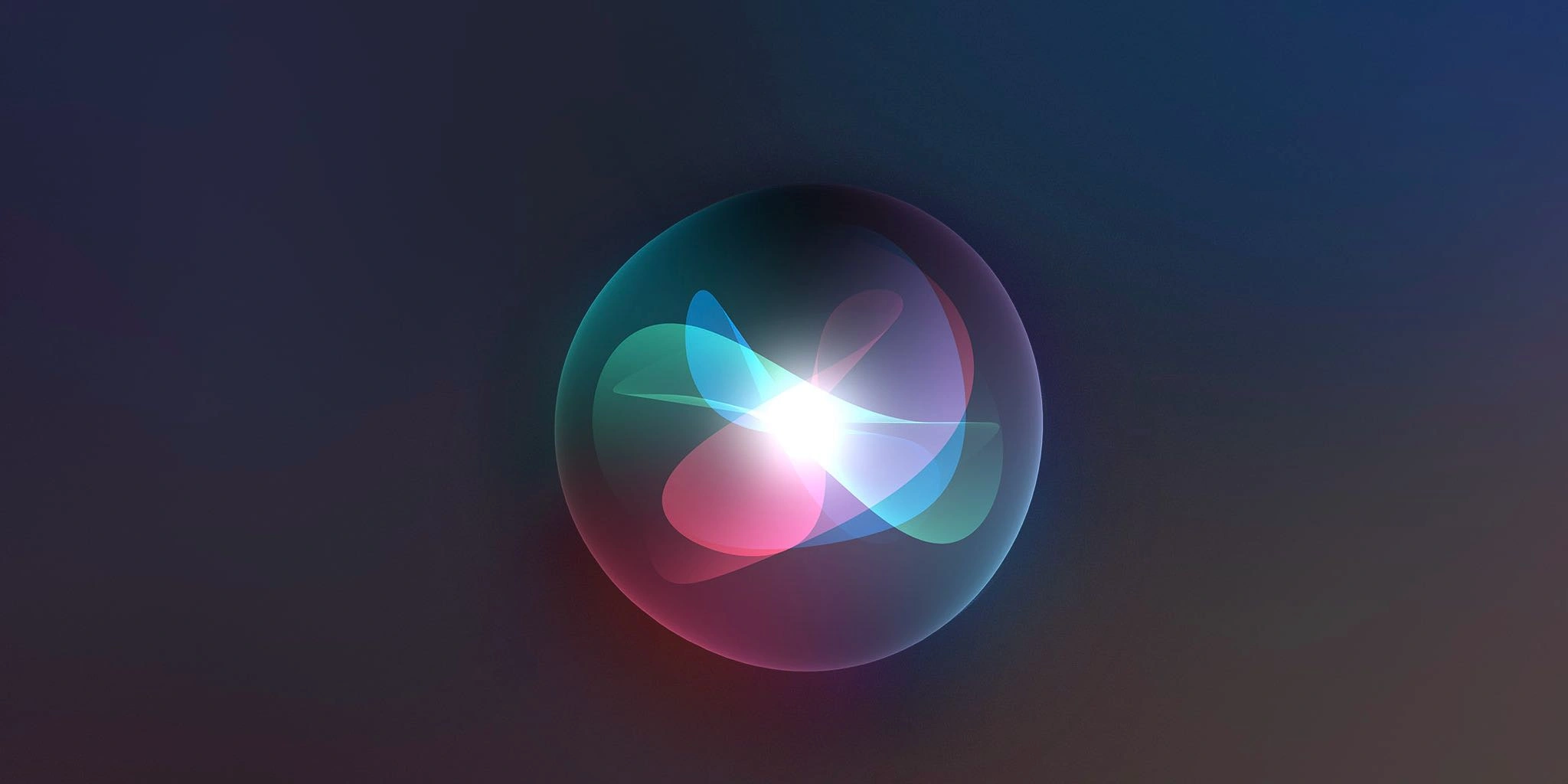 A glowing, multicolored abstract light pattern inside a transparent sphere against a dark background.
