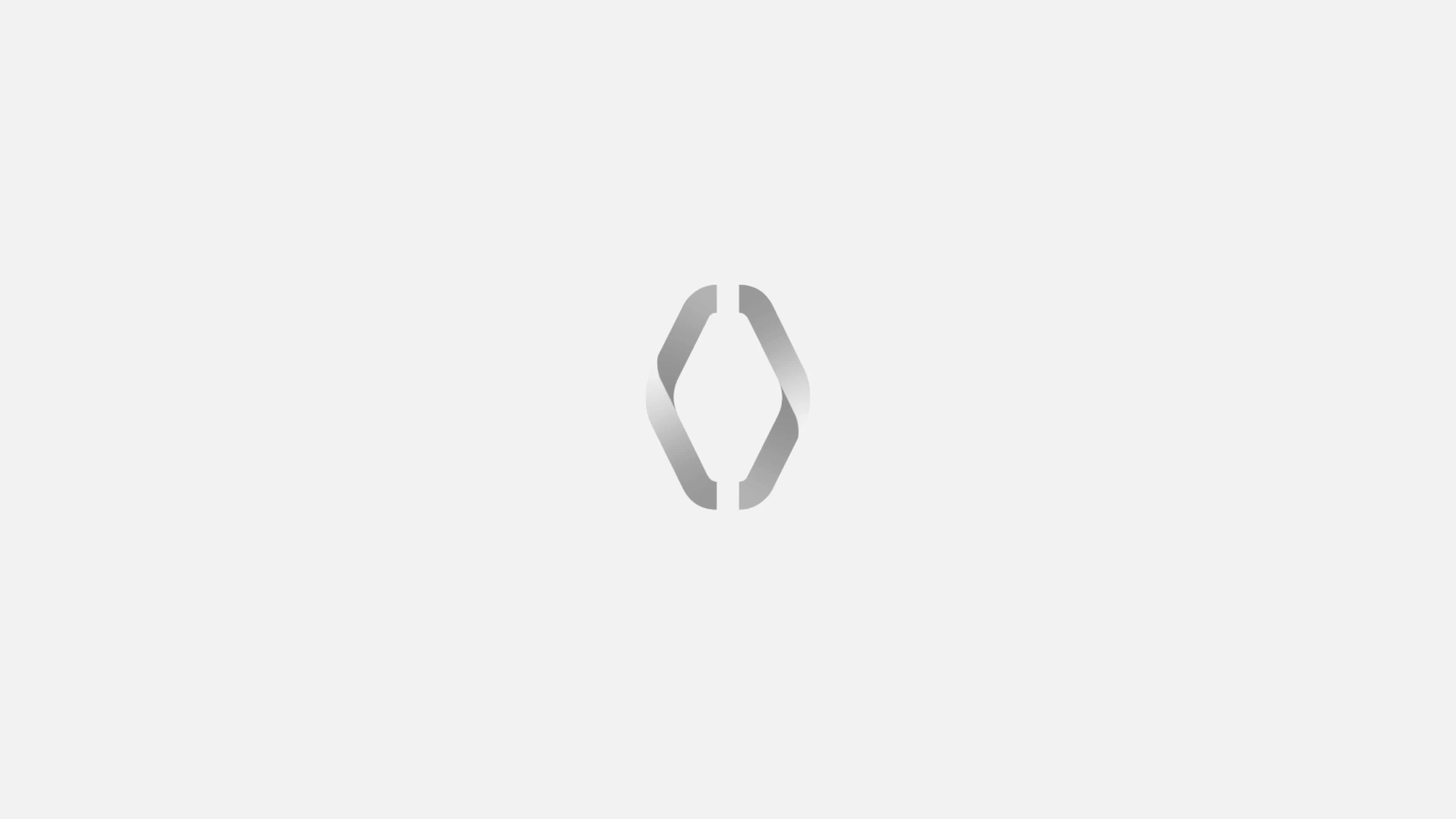 A stylized, abstract logo resembling a diamond shape with two symmetrical, curved lines on each side.