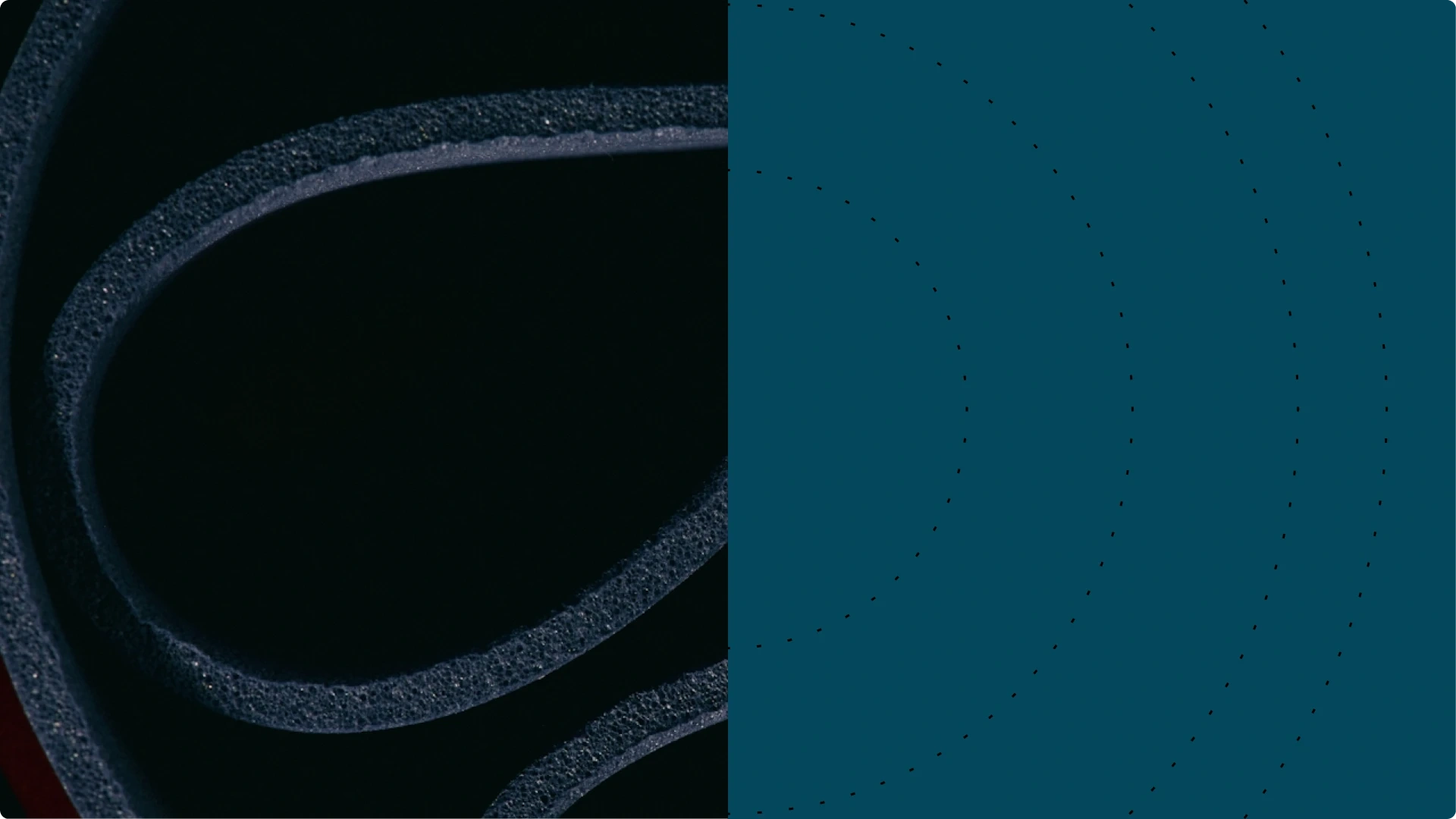 Close-up of a black foam yoga mat rolled up.