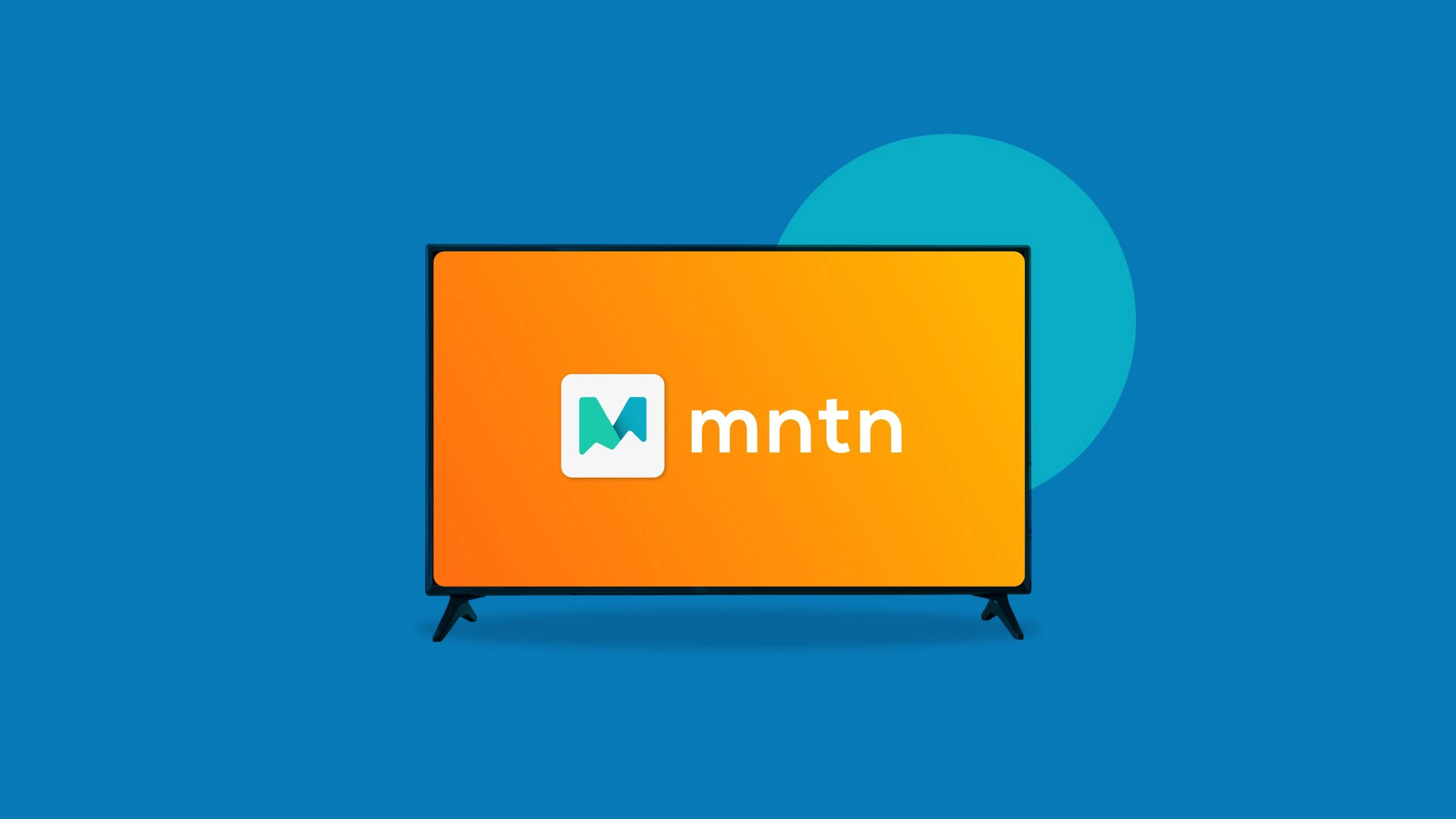 A television screen displaying the MNTN logo on an orange background.